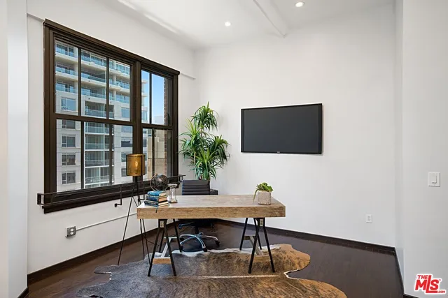 a view of a workspace with furniture