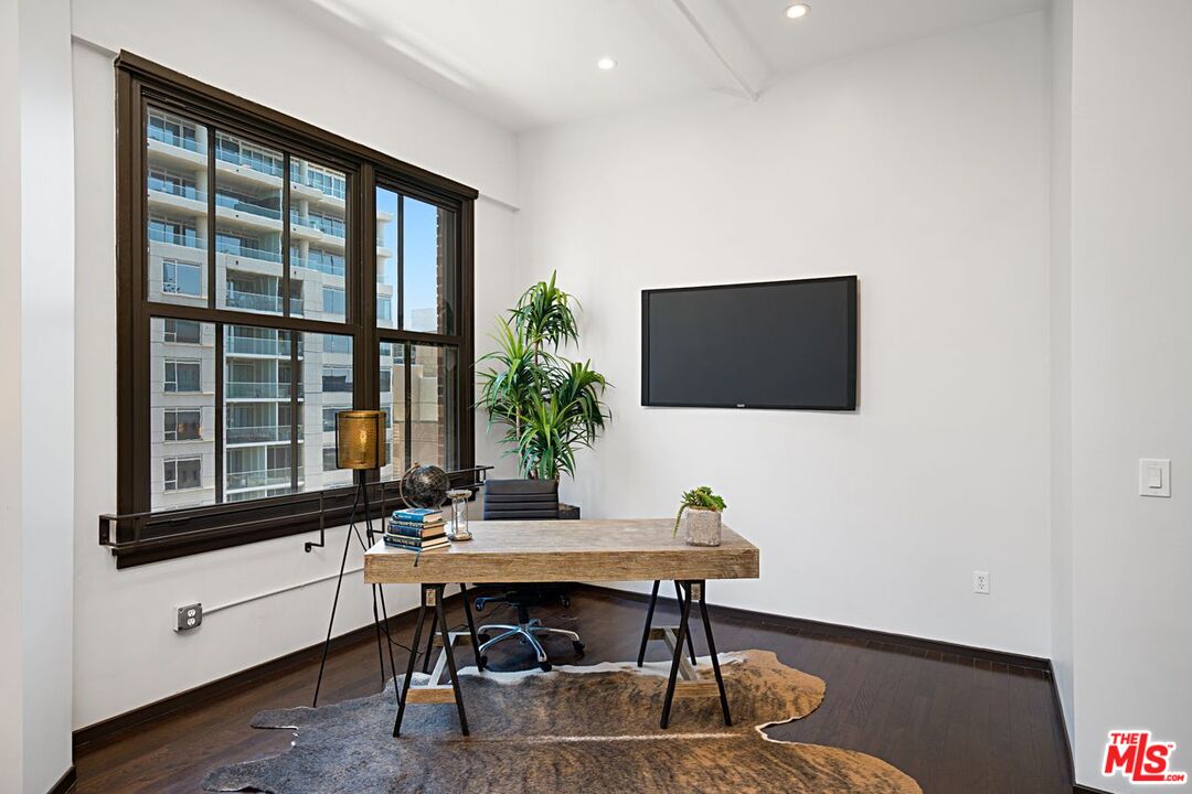1645 Vine Street, Unit 703 Los Angeles, CA 90028 - Photo 16 of 44 a view of a workspace with furniture