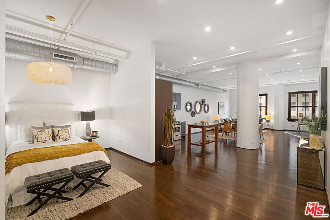 1645 Vine Street, Unit 703 Los Angeles, CA 90028 - Photo 2 of 44 a bedroom with furniture and wooden floor