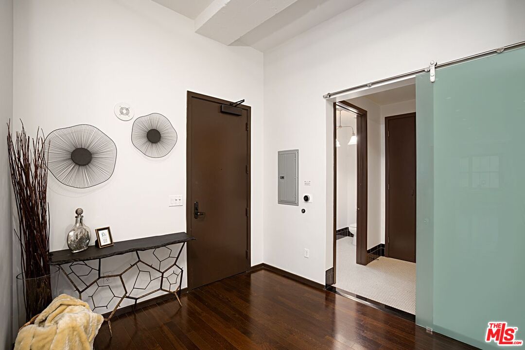 1645 Vine Street, Unit 703 Los Angeles, CA 90028 - Photo 23 of 44 a view of a hallway with wooden floor