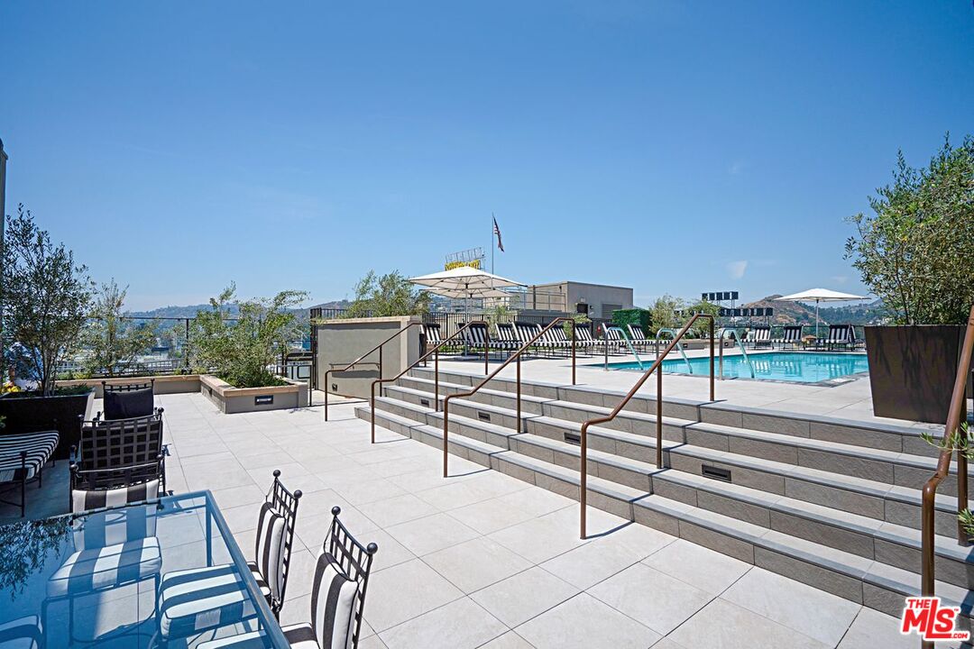 1645 Vine Street, Unit 703 Los Angeles, CA 90028 - Photo 28 of 44 a view of a terrace with sitting area