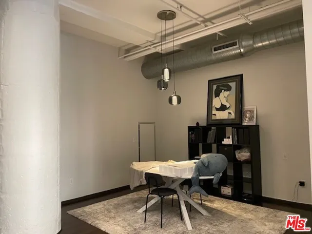 a bedroom with a large bed and a large window