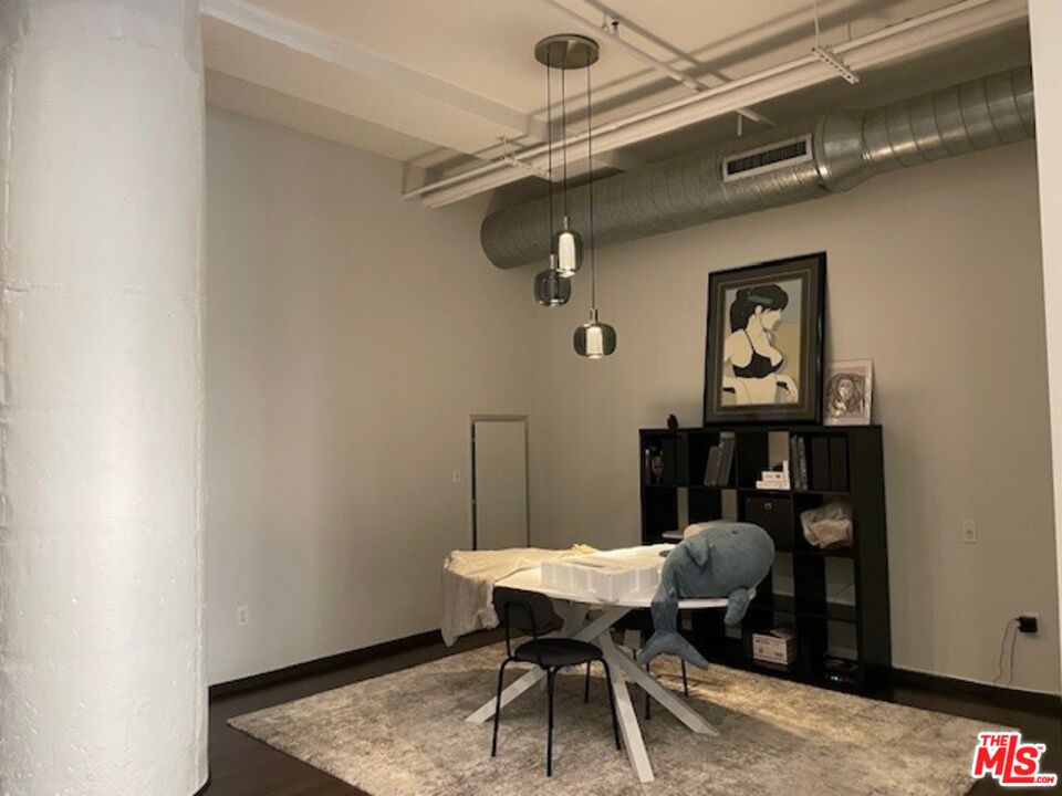 1645 Vine Street, Unit 703 Los Angeles, CA 90028 - Photo 42 of 44 a view of a table and chairs in a room