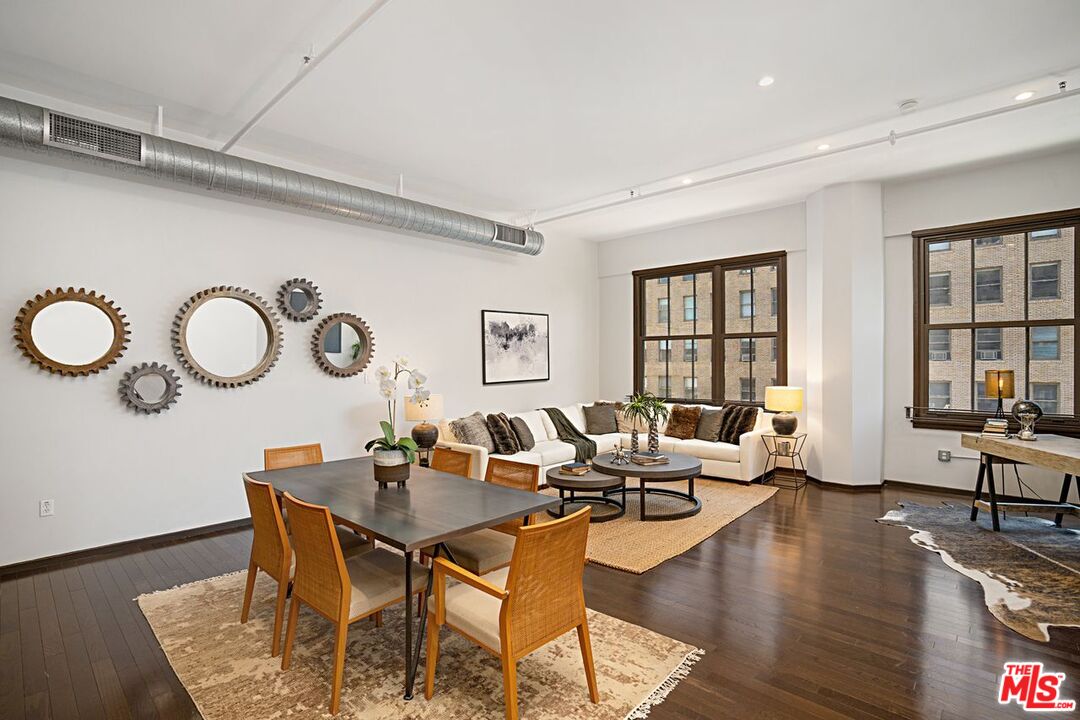 1645 Vine Street, Unit 703 Los Angeles, CA 90028 - Photo 7 of 44 a view of a dining room with furniture window and wooden floor