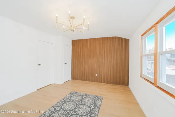 a view of room with a ceiling fan and window
