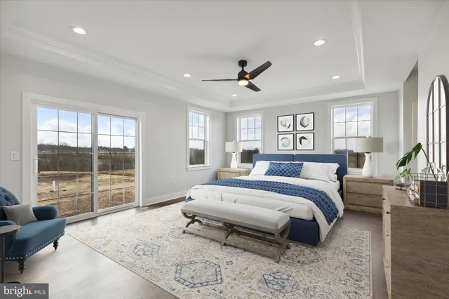 a view of staircase with wooden floor and pendant lights