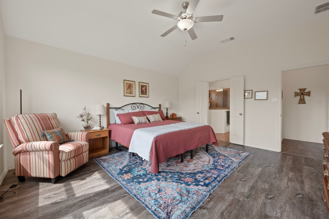 1437 Morning View Road Georgetown, TX 78628 - Photo 13 of 24 a bedroom with bed and wooden floor