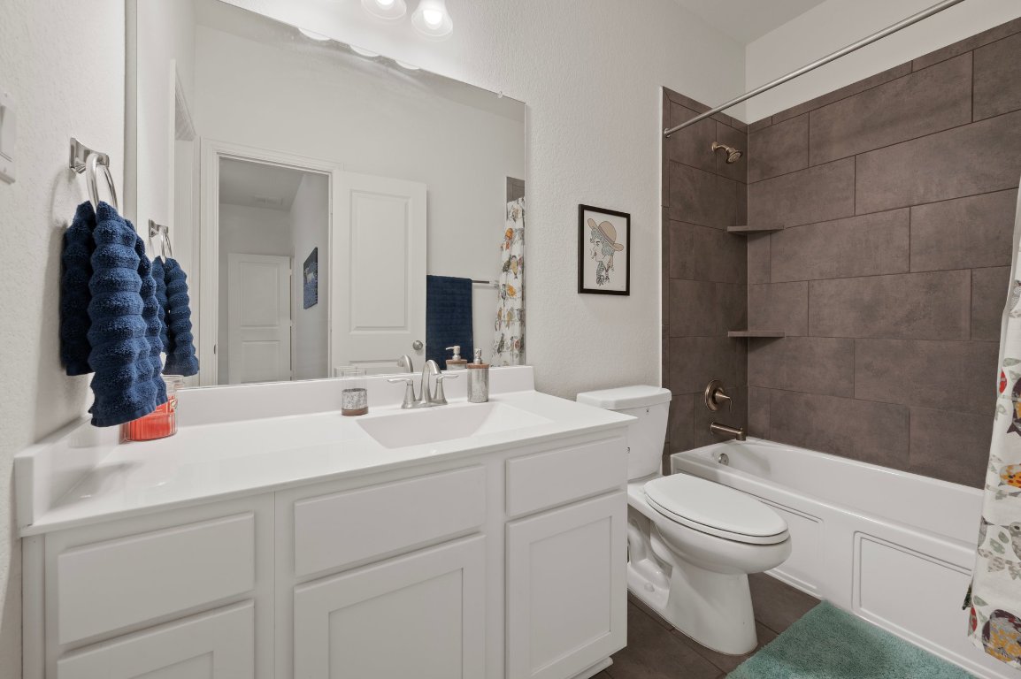 1437 Morning View Road Georgetown, TX 78628 - Photo 16 of 24 a bathroom with a sink toilet and shower