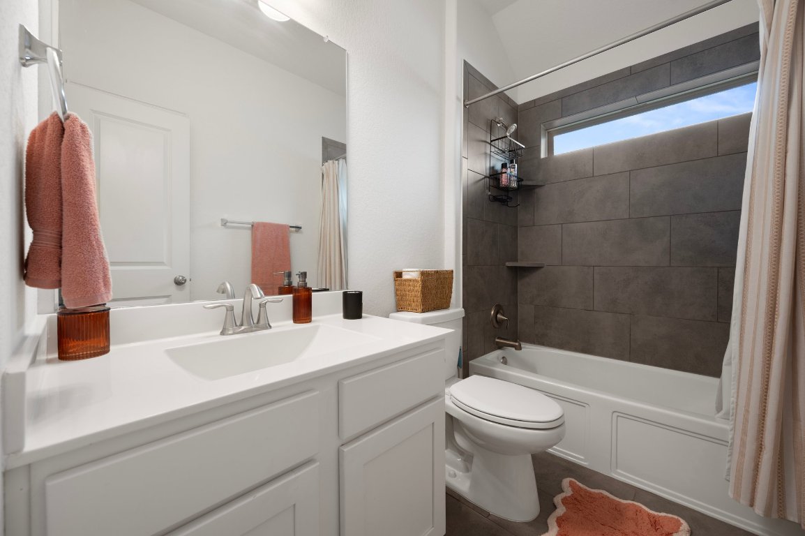 1437 Morning View Road Georgetown, TX 78628 - Photo 17 of 24 a bathroom with a sink a toilet and a bathtub