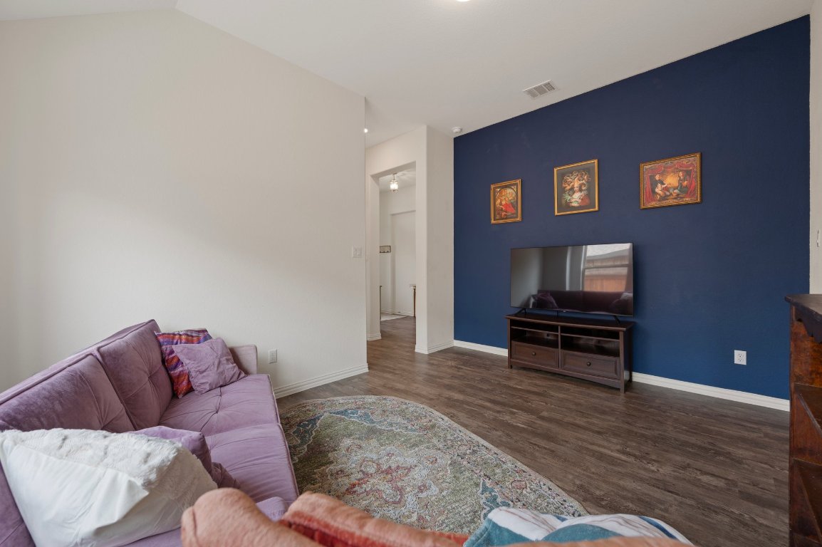 1437 Morning View Road Georgetown, TX 78628 - Photo 20 of 24 a living room with furniture and a wooden floor