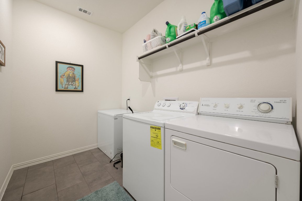 1437 Morning View Road Georgetown, TX 78628 - Photo 22 of 24 a utility room with dryer and washer