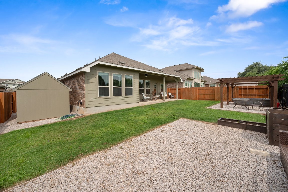 1437 Morning View Road Georgetown, TX 78628 - Photo 24 of 24 a front view of a house with a yard and garage