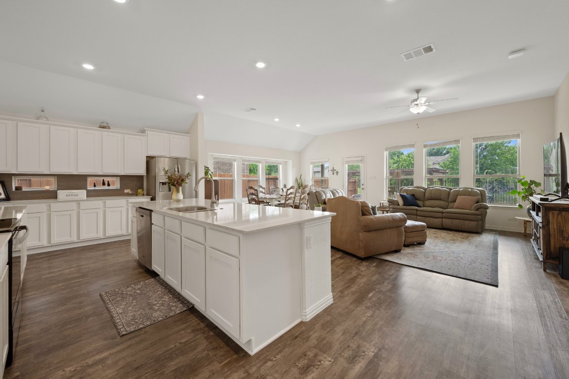 1437 Morning View Road Georgetown, TX 78628 - Photo 4 of 24 a large white kitchen with a large window a sink and a counter top space