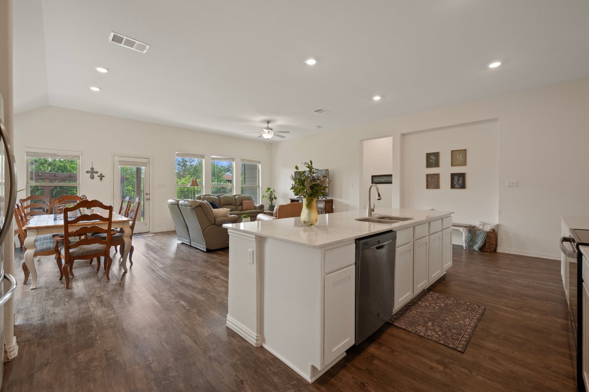 1437 Morning View Road Georgetown, TX 78628 - Photo 5 of 24 a large white kitchen with lots of counter top space and stainless steel appliances