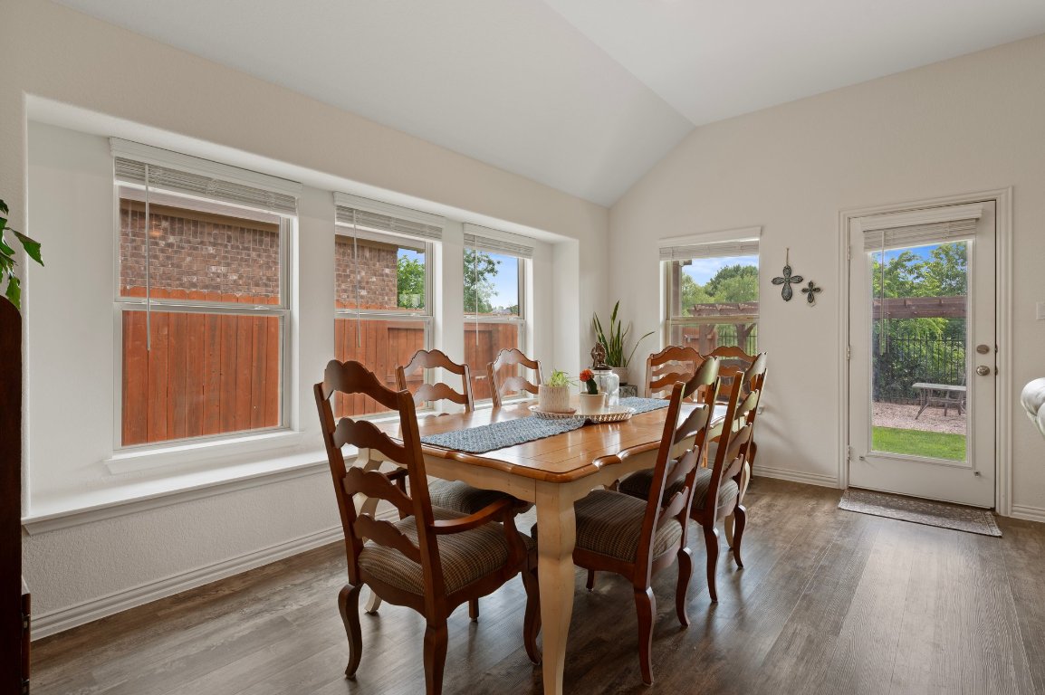1437 Morning View Road Georgetown, TX 78628 - Photo 7 of 24 a view of a dining room with furniture and wooden floor