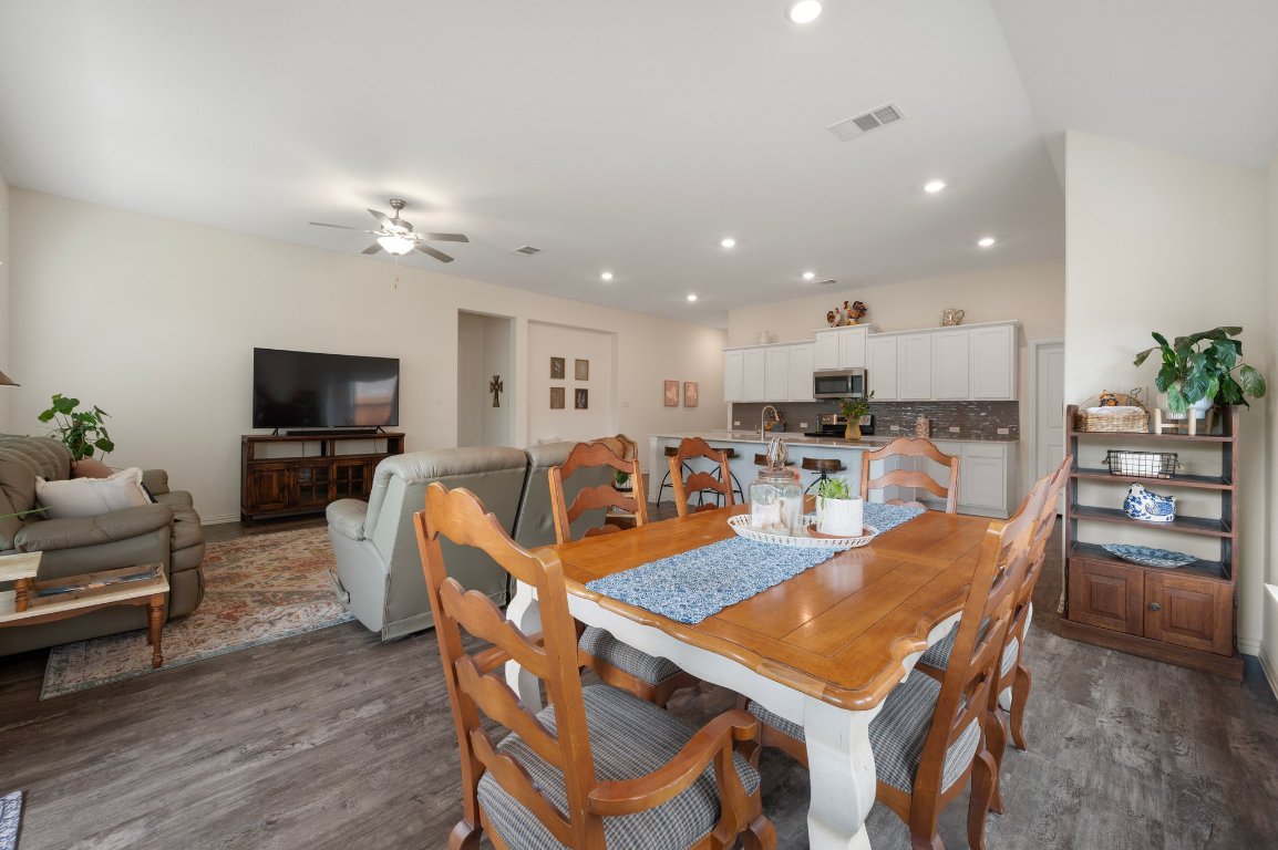 1437 Morning View Road Georgetown, TX 78628 - Photo 8 of 24 a living room with stainless steel appliances furniture and a flat screen tv