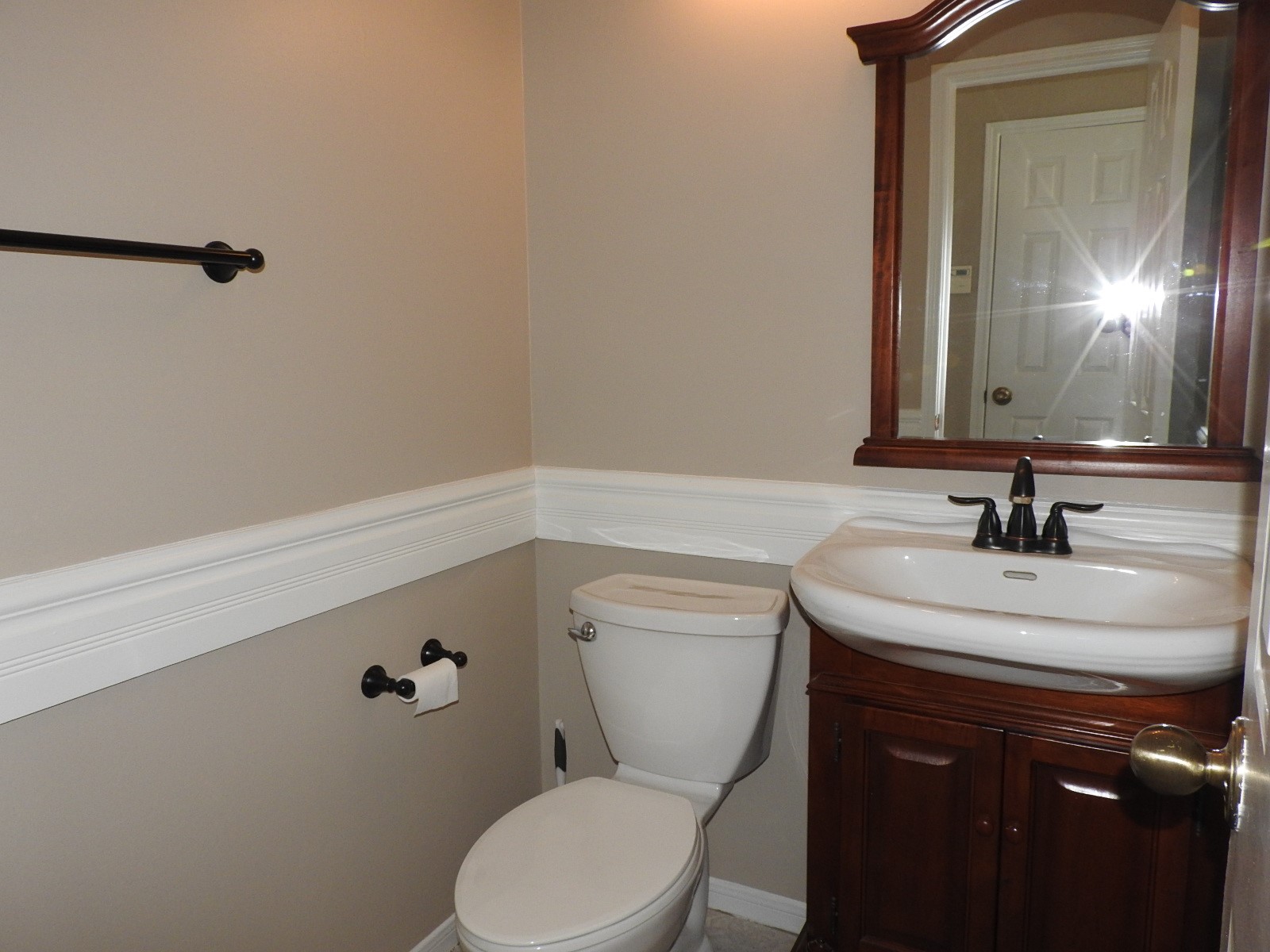 3107 Rimrock Drive Missouri City, TX 77459 - Photo 14 of 32 a bathroom with a granite countertop toilet sink and mirror