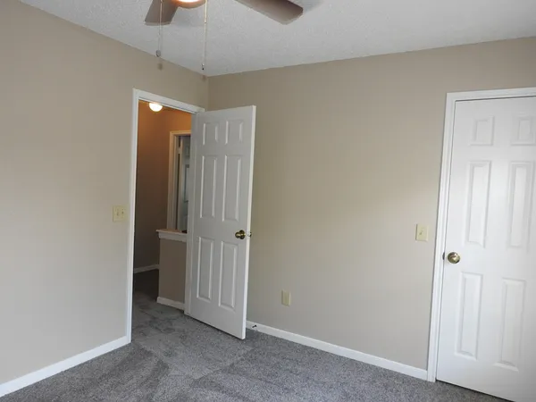 a view of a hallway with a chandelier