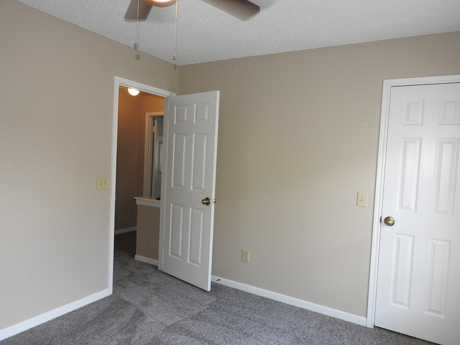 3107 Rimrock Drive Missouri City, TX 77459 - Photo 17 of 32 a view of a hallway with a chandelier