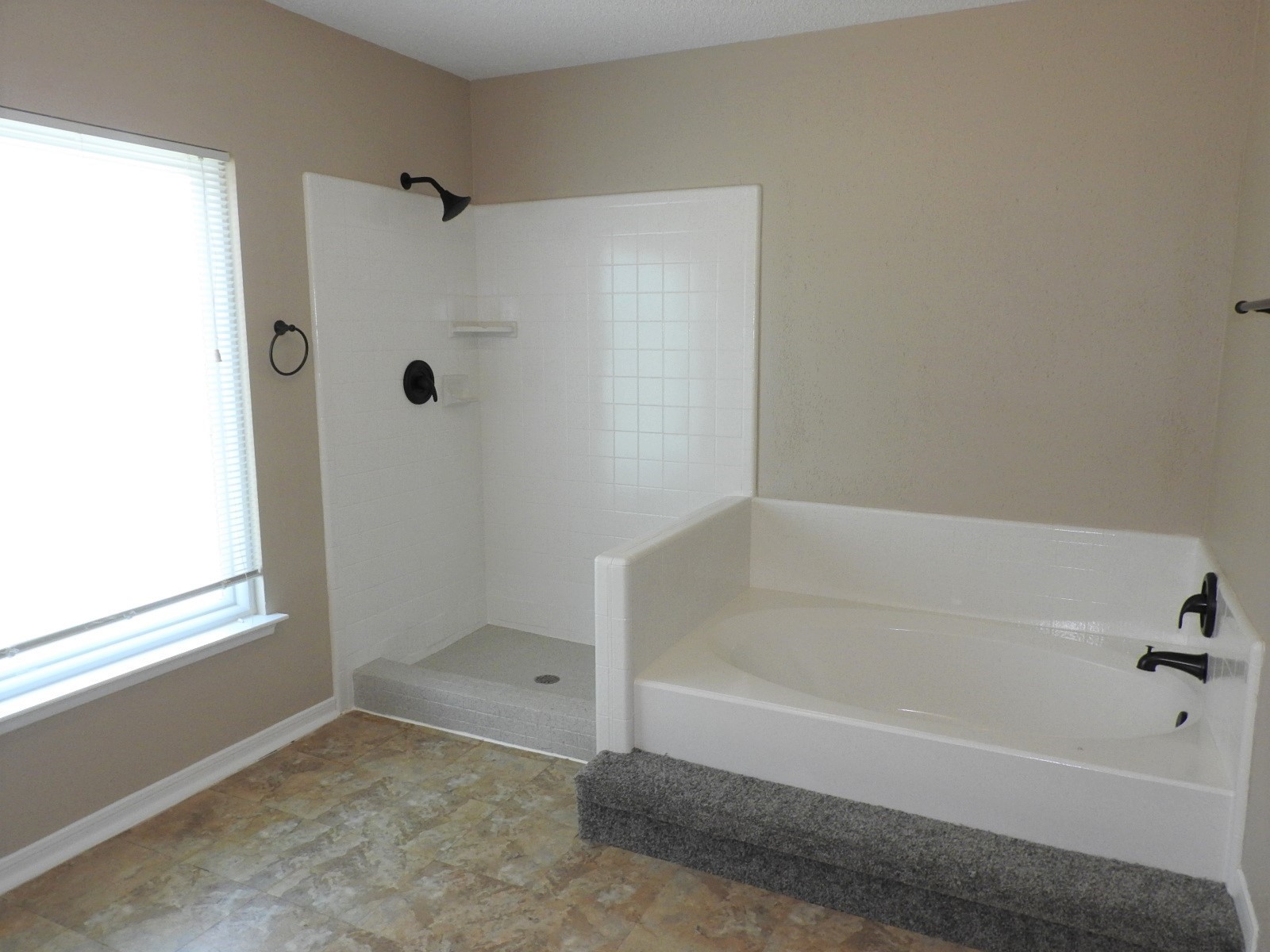 3107 Rimrock Drive Missouri City, TX 77459 - Photo 30 of 32 a bathroom with a bathtub and a shower
