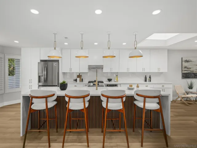 a view of kitchen with cabinets and wooden floor