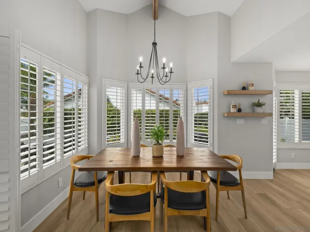 a bedroom with a bed and a potted plant