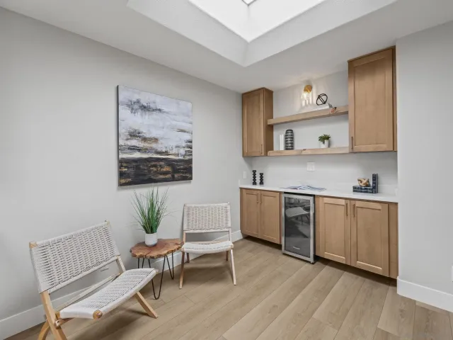 a bathroom with a shower sink and mirror