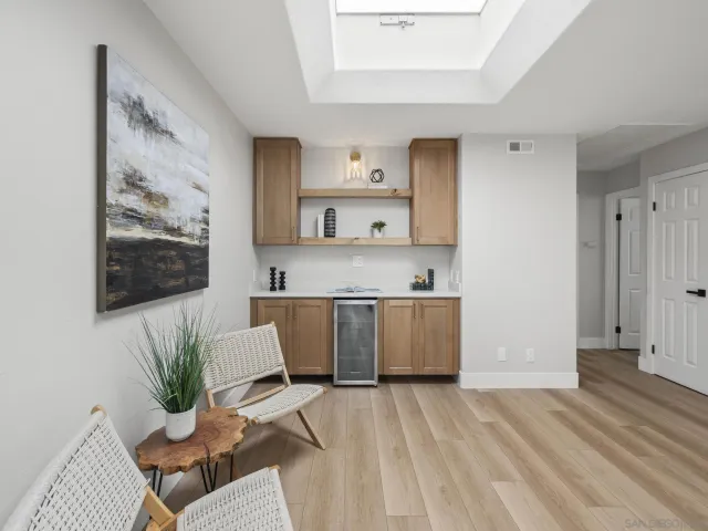 a bathroom with a double vanity sink toilet and shower