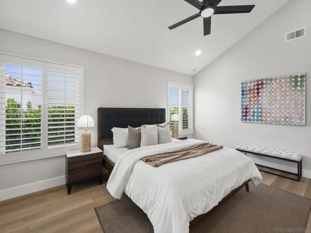 a view of a patio with table and chairs and potted plants