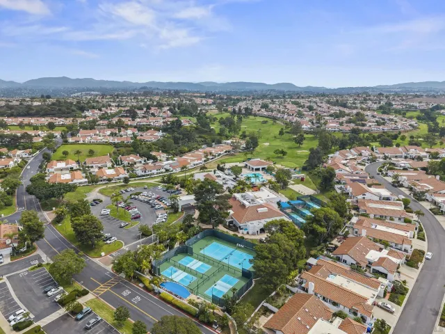 an aerial view of residential houses and outdoor space