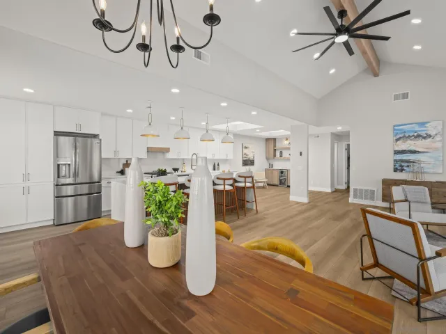 a living room with furniture and kitchen view