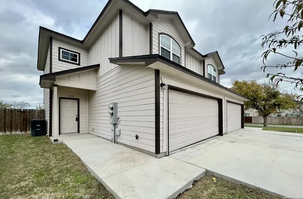 a view of a house with a garage