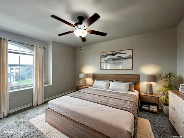 a bedroom with a large bed and a window