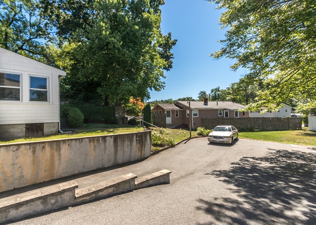 1172 Trapelo Road Waltham, MA 02451 - Photo 22 of 25 a view of a swimming pool with a patio and a lounge chair