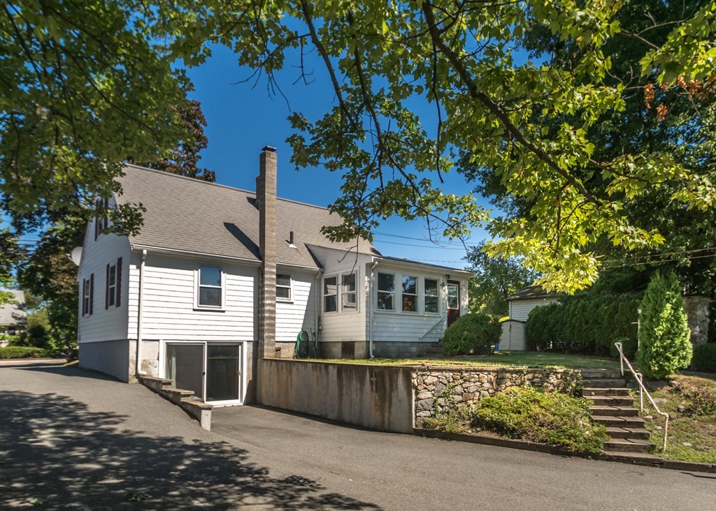 1172 Trapelo Road Waltham, MA 02451 - Photo 23 of 25 a front view of a house with a garden
