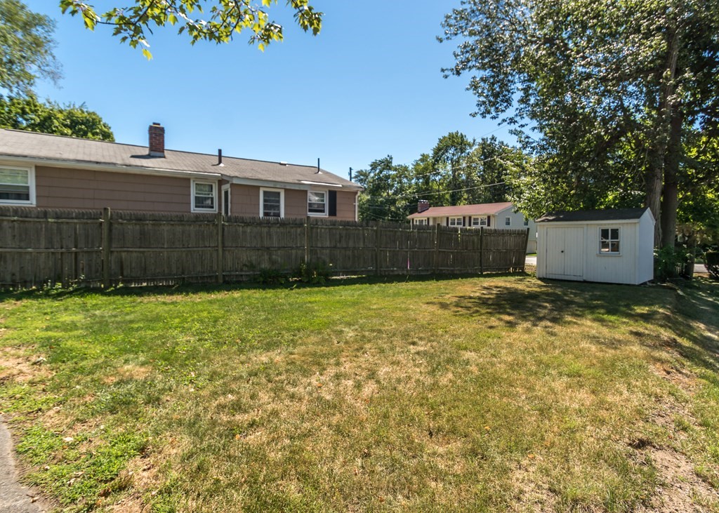 1172 Trapelo Road Waltham, MA 02451 - Photo 24 of 25 a front view of a house with a yard