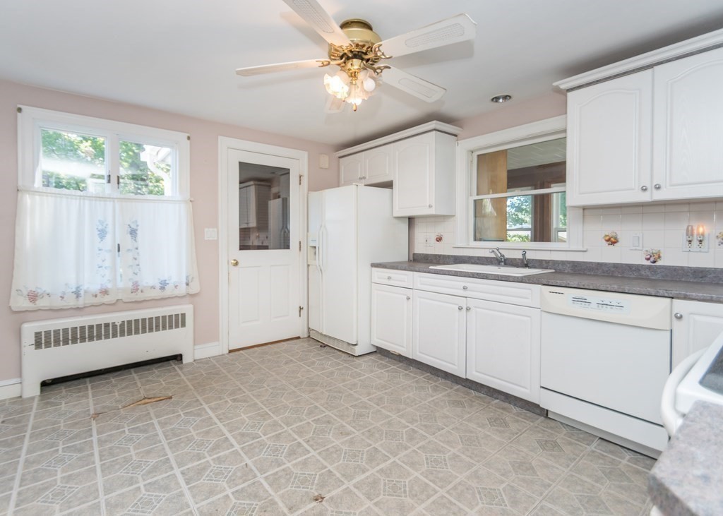 1172 Trapelo Road Waltham, MA 02451 - Photo 5 of 25 a kitchen with a sink cabinets and window