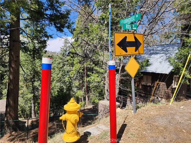 a street sign that is on a sidewalk