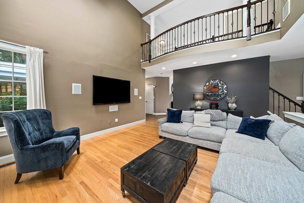 105 Waterman Road Canton, MA 02021 - Photo 11 of 39 a living room with furniture and a flat screen tv