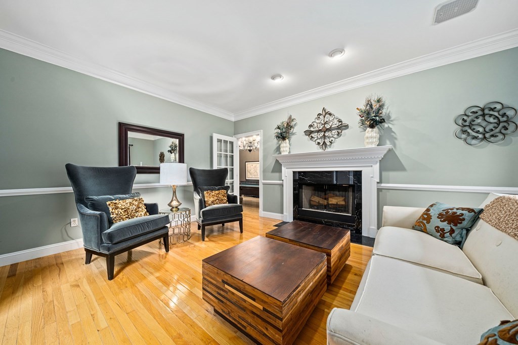 105 Waterman Road Canton, MA 02021 - Photo 16 of 39 a living room with furniture and a fireplace