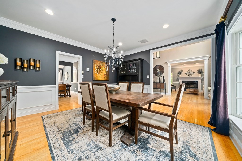 105 Waterman Road Canton, MA 02021 - Photo 20 of 39 a dining room with furniture a rug and a chandelier