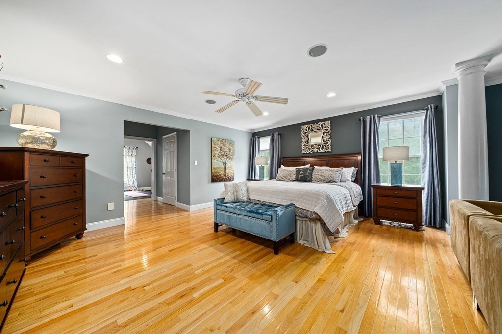 105 Waterman Road Canton, MA 02021 - Photo 22 of 39 a bedroom with a bed and wooden floor