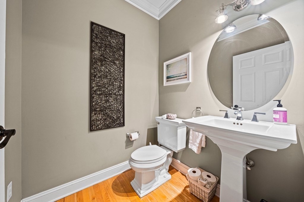 105 Waterman Road Canton, MA 02021 - Photo 31 of 39 a bathroom with a toilet a sink and mirror