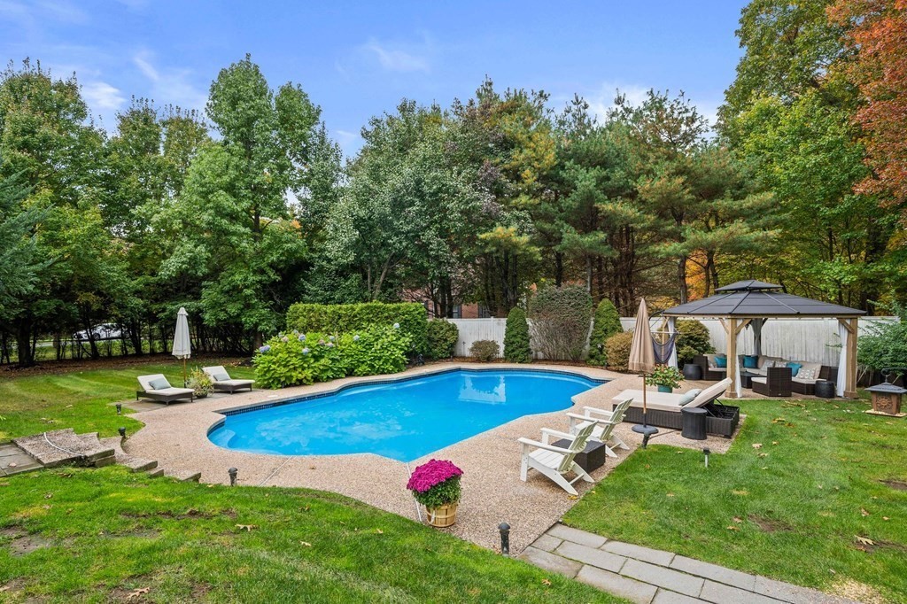 105 Waterman Road Canton, MA 02021 - Photo 38 of 39 a view of a swimming pool with lawn chairs and a big yard