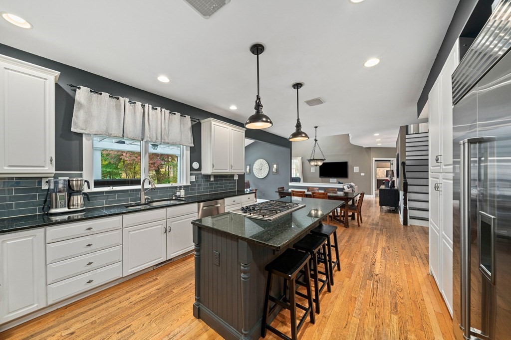 105 Waterman Road Canton, MA 02021 - Photo 5 of 39 a kitchen with a sink stove and cabinets