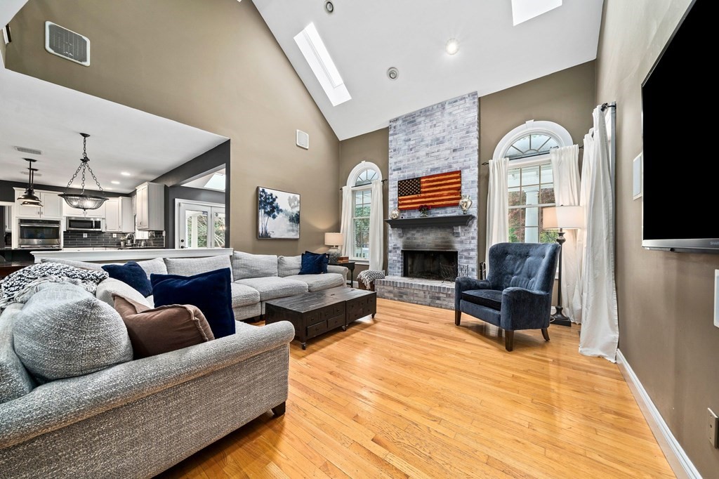 105 Waterman Road Canton, MA 02021 - Photo 10 of 39 a living room with furniture fireplace and a flat screen tv
