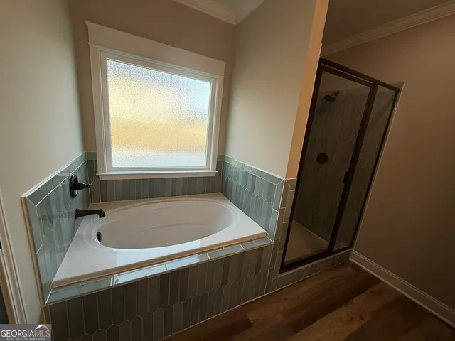 a bath tub sitting next to a window