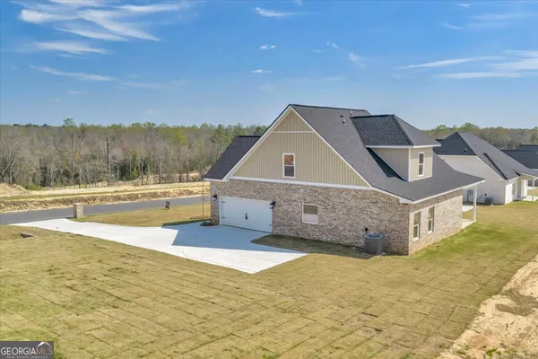 a front view of a house with a yard