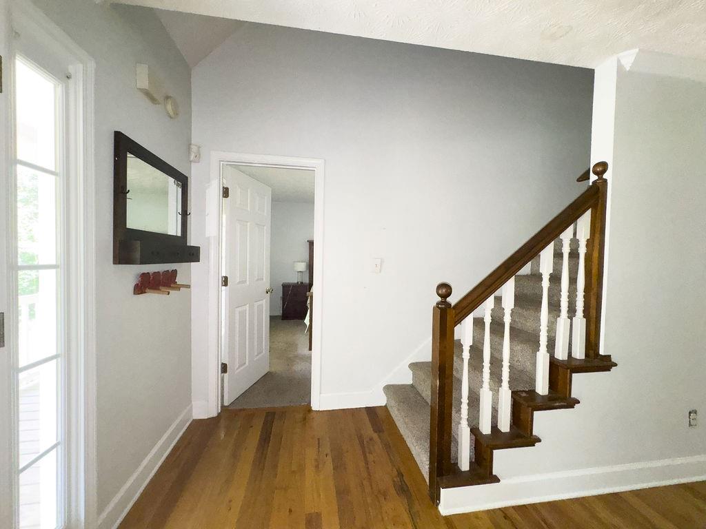 66 Stevenson Point Dallas, GA 30132 - Photo 11 of 39 a view of a hallway with wooden floor and staircase