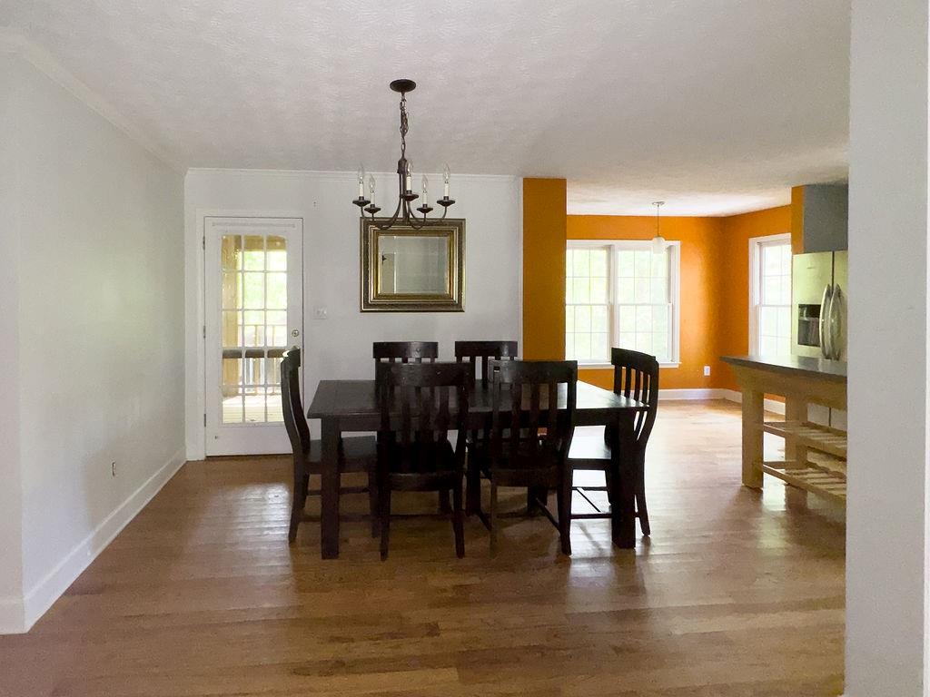 66 Stevenson Point Dallas, GA 30132 - Photo 13 of 39 a view of a dining room with furniture window and wooden floor